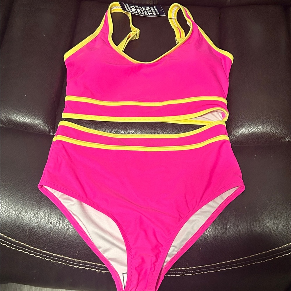 Woman’s pink and yellow bikini